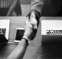 Business people shaking hands in agreement